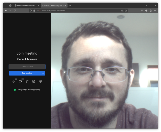 A Firefox window showing a jitsi side joining page. The camera is on and show Kierans (libcamera maintainer) face.