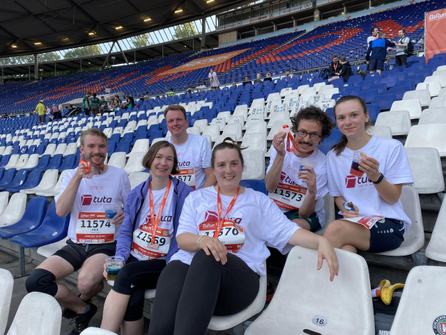 Tuta Team sit smiling after completing the B2B run. 