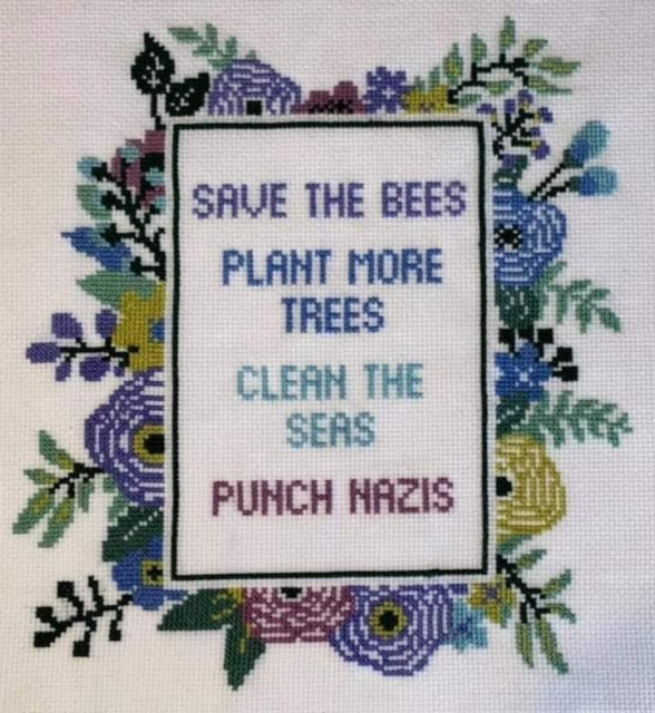 Embroided work Caption = Save the bees Plant more trees Clean the seas Punch nazis