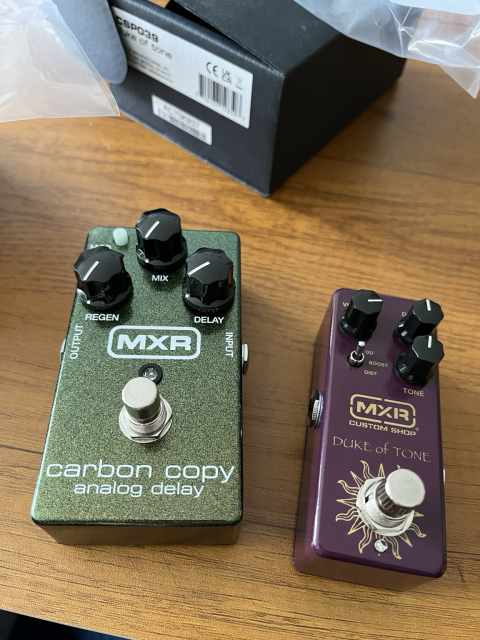 2 MXR guitar pedals: an analog delay and a “Duke of Tone” overdrive