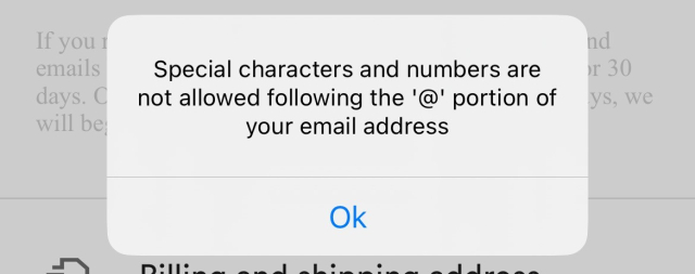 Screenshot of a popup error reading "Special characters and numbers are not allowed following the '@' portion of your email address"