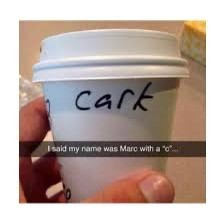 That famous image of a hand holding a takeaway coffee cup with “Cark” written on it. Text reads “I said my name was Marc with a ‘C’”