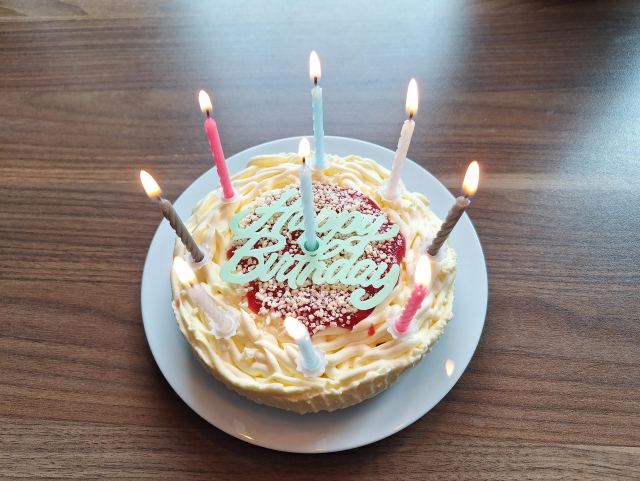 Birthday cake with 9 lit candles 