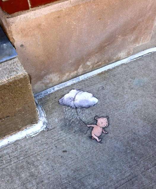 Streetart. In the corner of a house on the ground, a little Mouse (I think...he's naked), was drawn with chalk, leading a cloud for a walk. He has wrapped a string around the cloud several times and is running away with it as if it were a balloon.
Title: "Rudy is prepared at any moment to rain on your parade."