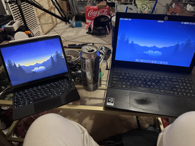 Coffee table with an iPad and laptop in it showing my gnome desktop on both displays 