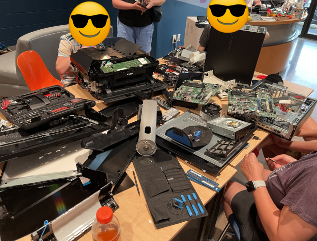 A shot later on where the table is completely covered with PCBs and various electronics all taken a part in a wonderful joyous mess.