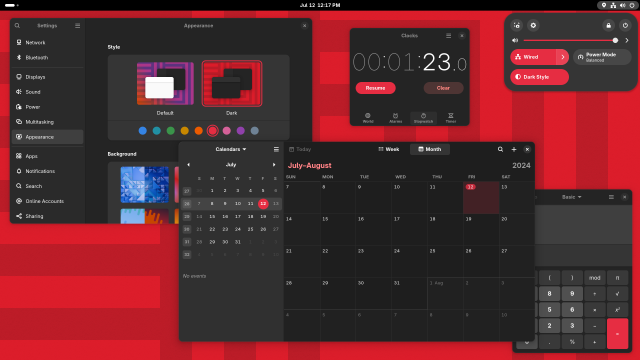 Screenshot of the GNOME desktop with the Settings, Calendar, Clock, and Calculator apps open, but with the dark style preference, red accent color, and matching wallpaper