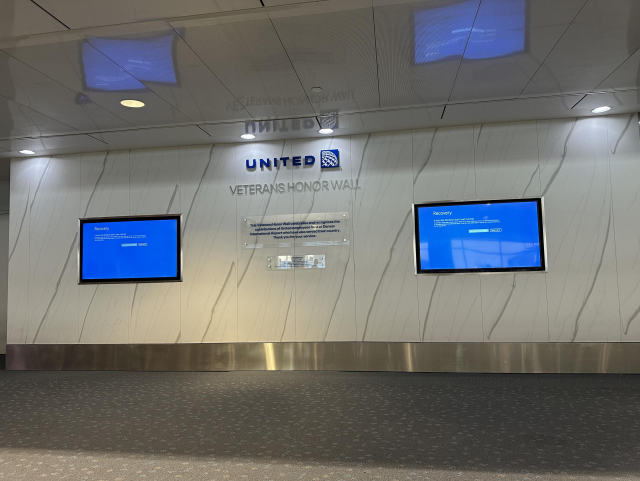 A display to honor military veterans who work at Denver Airport all blue screened by the failed Crowdstrike update.