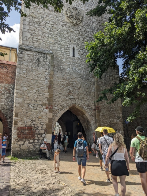 All photos show old-ish building in Kraków, like a city gate, or busy streets.