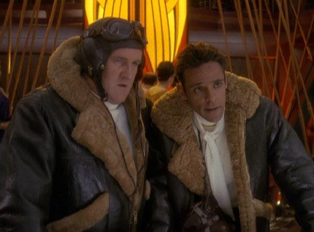 a frame from _Star Trek: Deep Space Nine_. 

we're in quark's bar.
Centered are Chief O'Brien and Doctor Bashir; they are both wearing jackets & gear used by british pilots in the battle of britain, one of their go-to holosuite simulations.