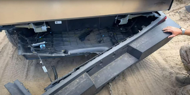 photo from the youtube channel whistlindiesel showing a cybertruck’s internal frame completly snapped in pieces after trying to tow another vehicle