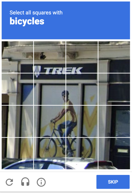 Screen shot of a Google CAPTCHA asking "Select all squares with bicycles" while showing a photo of a store front with an illustration of somebody riding a bike.