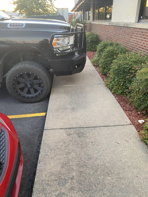 Parking your 2 ton death machine's hood over the pavement like an arsehole.