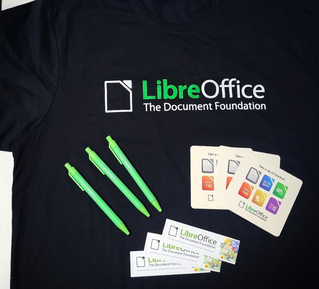 A black LibreOffice tshirt, pens, coasters, and stickers. 