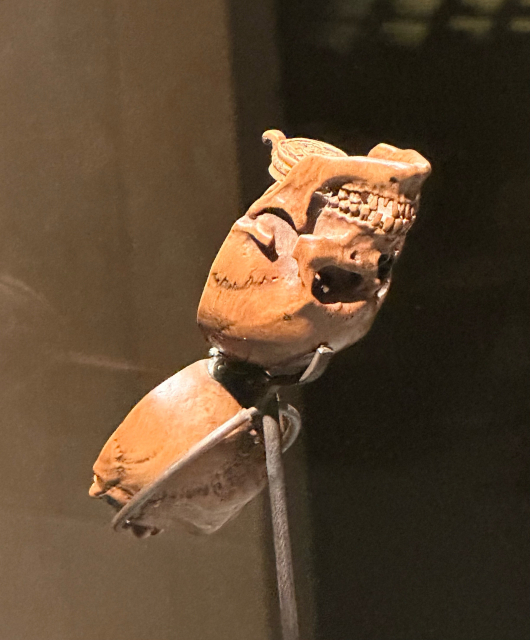 A 16th century boxwood prayer bead shaped like a skull