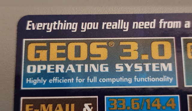 A sticker on a laptop, advertising it runs GEOS 3.0 OPERATING SYSTEM, which is "Highly efficient for full computing functionality"