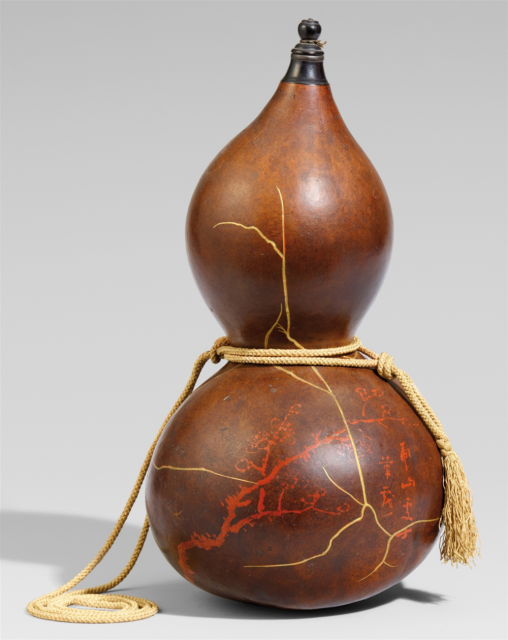 Gourd turned into a bottle with carry string