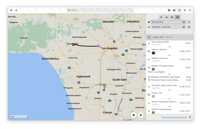 Screenshot of GNOME Maps showing public transit routing between two points in the Los Angeles urban agglomeration, tracing differently colored lines between three transit systems/companies