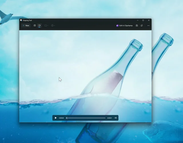 A screenshot of a finished screen recording (with snipping tool up and you can play the video. The video itself showing a just a recording of me moving my mouse around my monitor, which happens to have a message in the bottle wallpaper)