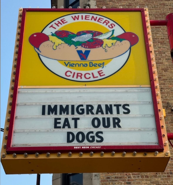 Sign from The Wieners Circle hot dog stand in Chicago that reads "Immigrants eat our dogs"