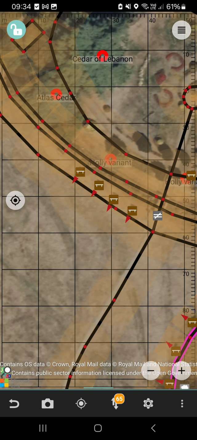 Screen grab of Vespucci editor, showing four bench icons each with a small red pointer indicating the direction of view from the bench.