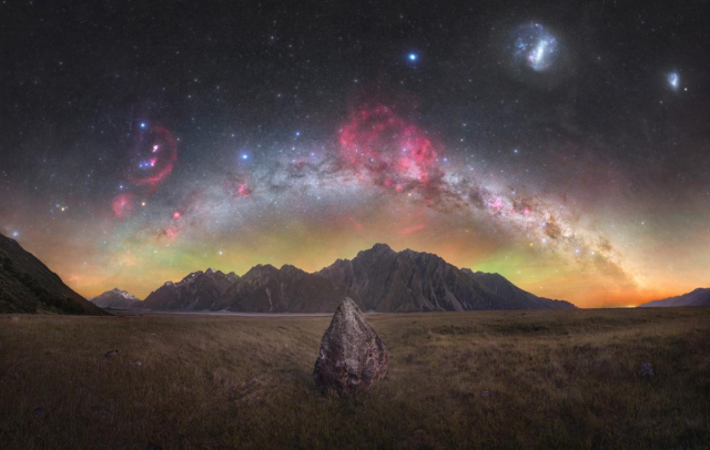 "It’s very challenging to create this sort of composition without tipping the balance in favour of either foreground or background. Here, the grass and central rock retain wonderful detail, as do the midground mountains, but the vibrance and detail in the cosmic background shine through as well. 

"Even the airglow adds to the image, which is no easy feat! As well as being technically impressive, the balance also produces a sort of surreal quality. A slightly dream-like connection between the Earth-bound and the celestial."