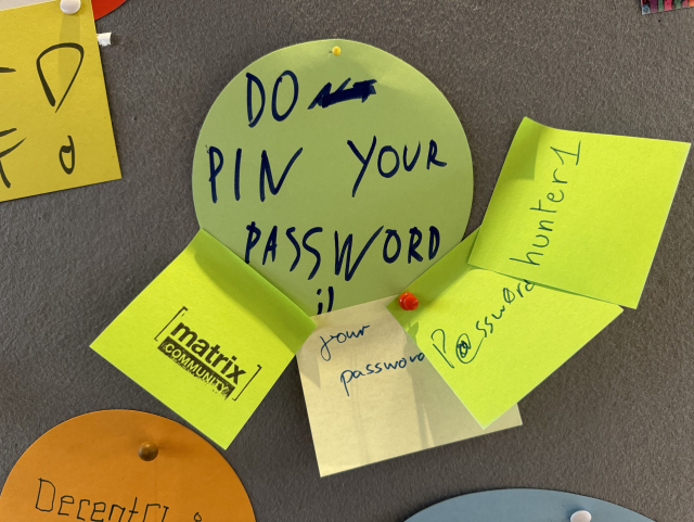 A picture of a sticky note saying “do not pin your password” and several other notes below with “your password”, “P@ssw0rd” and “hunter1”