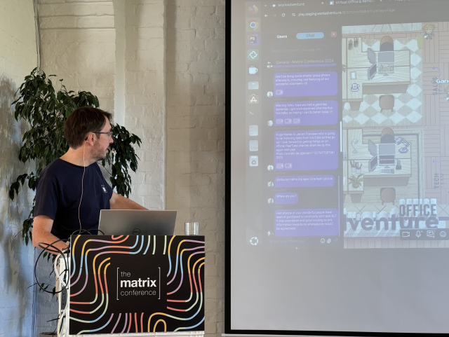 A picture of the speaker looking at his demo: there is a messager open in the left part of his screen. It is using Matrix behind the scenes