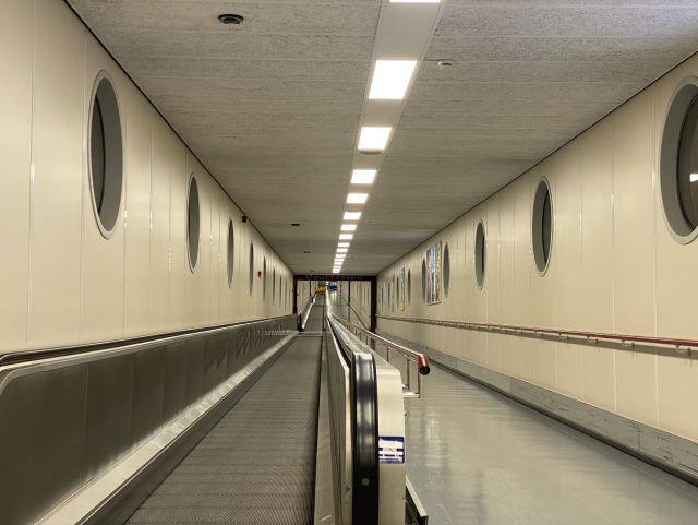 An endless covered walkway – a travelator on the left, normal path on the right. You can’t see the end.