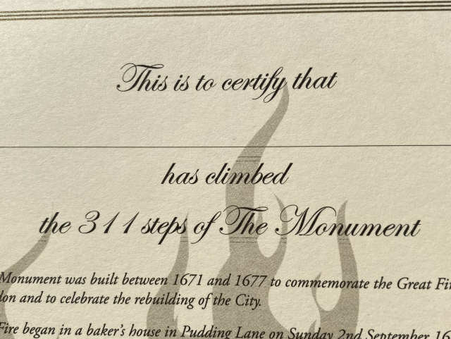 A certificate reading: “This is to certify that ____ has climbed the 311 steps of The Monument.”