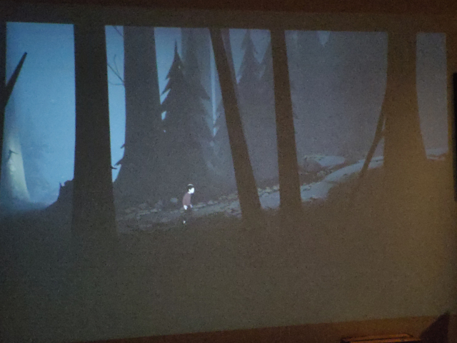 A scene from the game INSIDE being projected onto a wall.