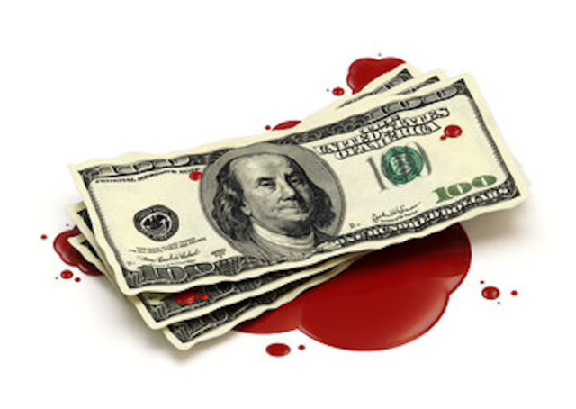 Three US $100 bills in a pool of blood.