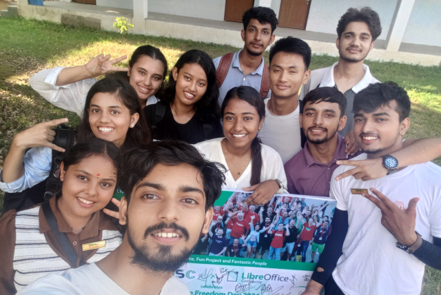 Community members with signed LibreOffice poster