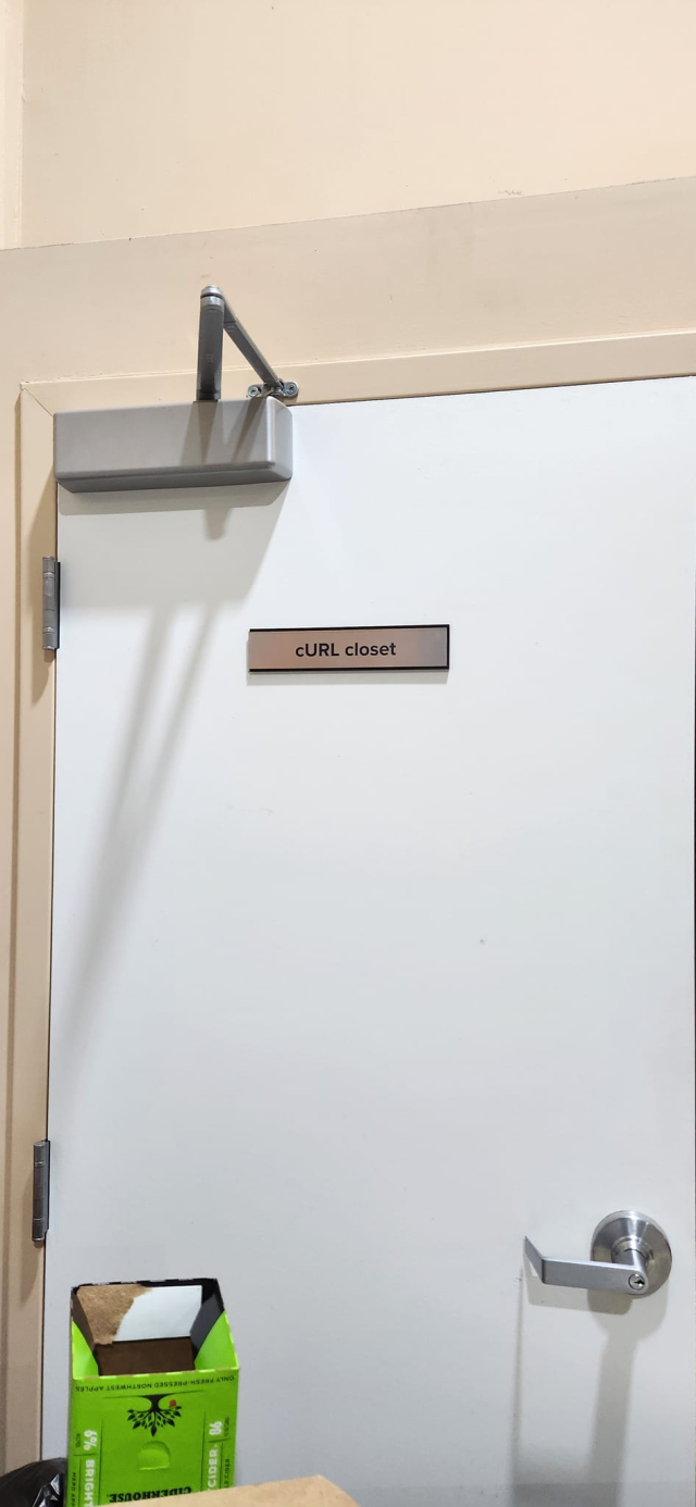 A door with a sign saying "cURL closet"