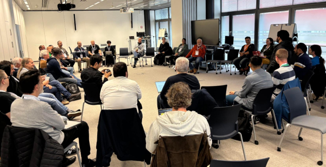 Photo of community members sitting in a circle