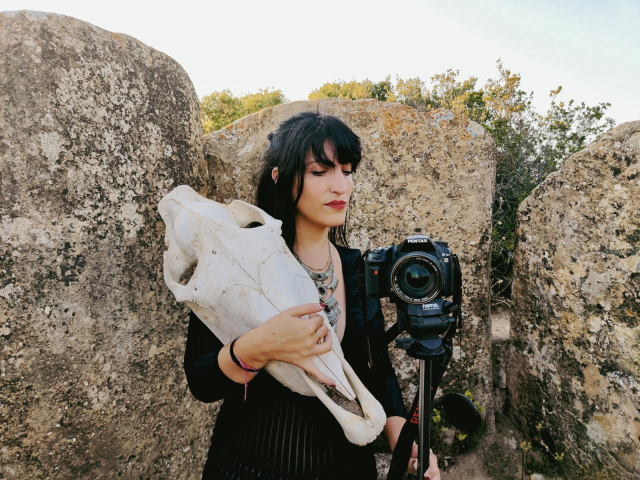 Portrait of myself, with a horse skull and a camera. 