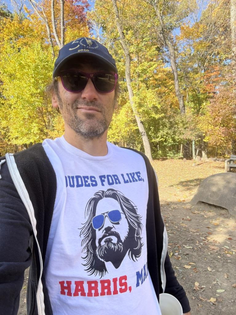 Jeff wearing a shirt that says, "Dudes for Like Harris, Man", with a sketch of "The Dude" wearing blue shades on it