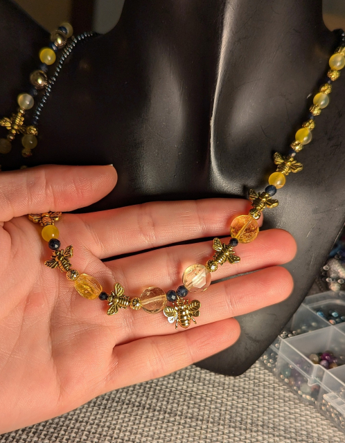 A handmade set for Bee lovers with yellow citrine, yellow Agate and blue Sapphire gemstones
Gold plated bee main pendant and golden bee beads