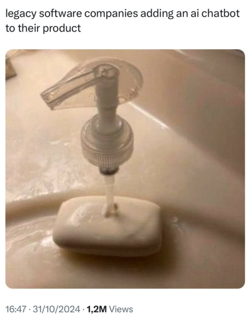 A soap dispenser pump awkwardly positioned on top of a bar of soap. Text above reads, "legacy software companies adding an ai chatbot to their product."