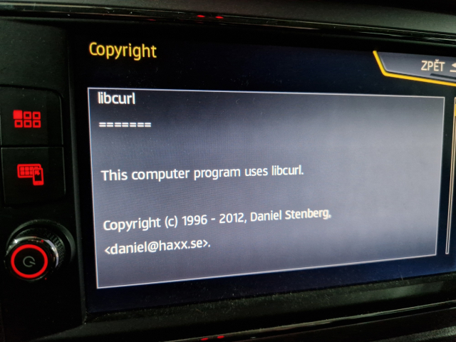 Photo of an infotainment display in a Seat Leon car, showing copyright attribution screen, with "This computer program uses libcurl. Copyright (c) 1996 - 2012, Daniel Stenberg". A small scrollbar is visible, hinting to a lot of other attributions.