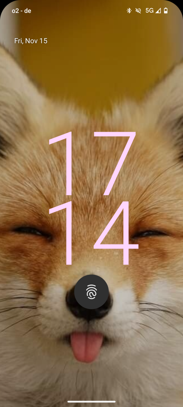 my phone's lock screen, the fingerprint reader is placed above the nose of a fox