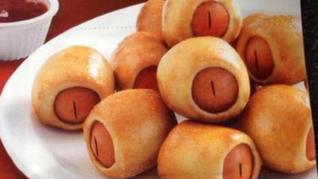 picture of what i think is a plate full of pigs in a blanket (the food, not real pigs in a blanket)