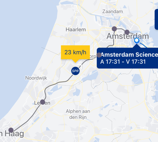 Screenshot from the NS app’s map view, showing the train from Den Haag to Leiden to Amsterdam somewhere between Leiden and Schiphol doing 23 kph.