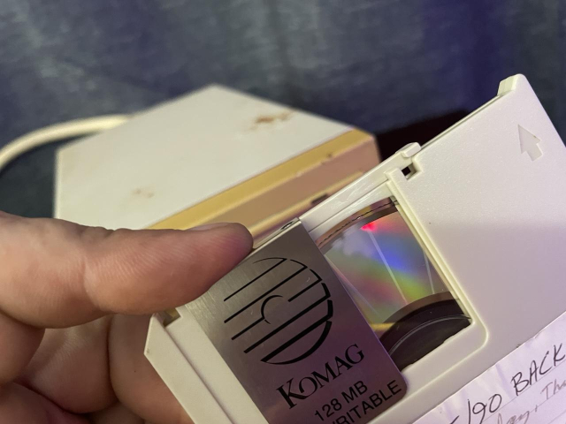 The disk inside the casing looks like a small CD. 