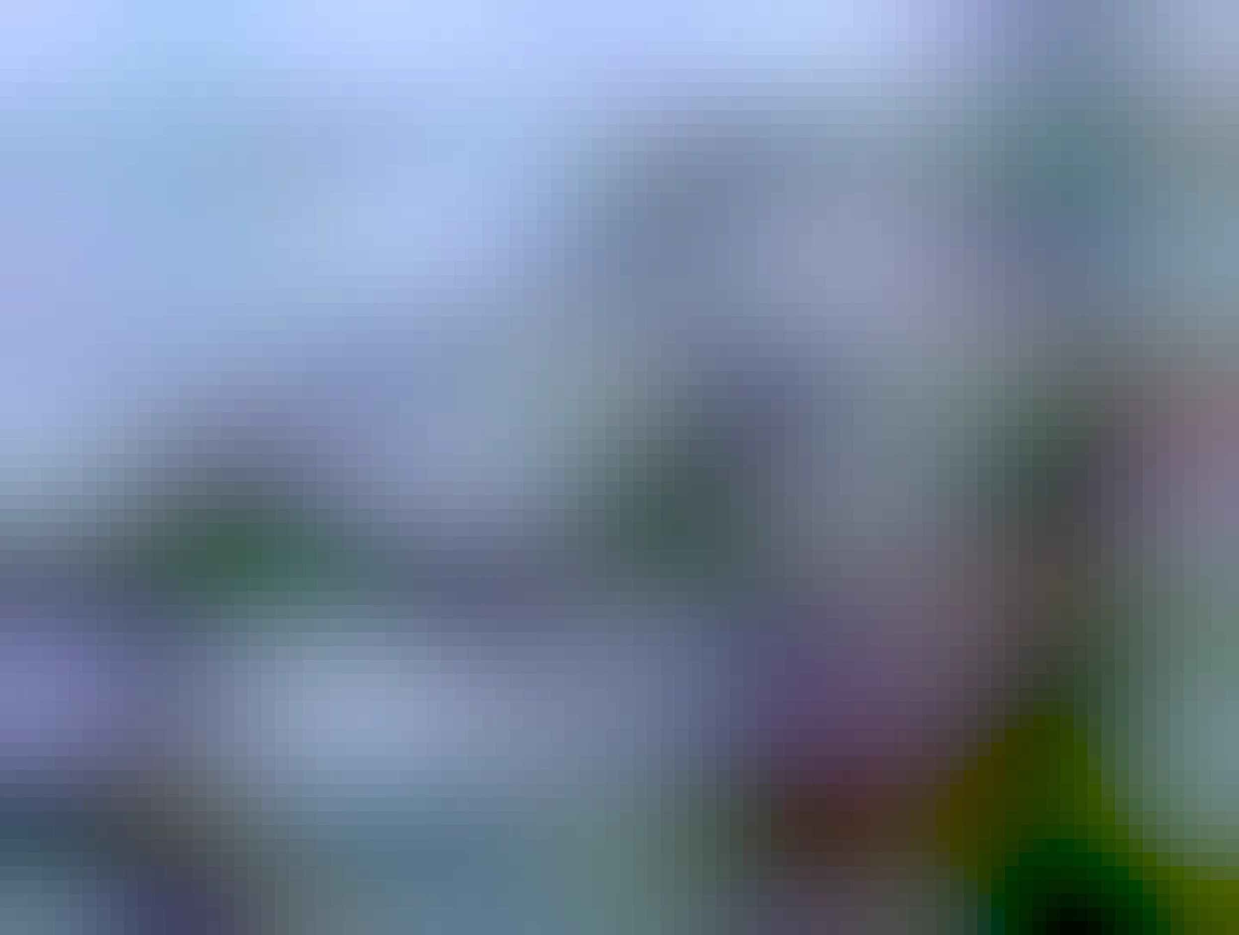 Street in Berlin with parked cars and an apartment building in the background