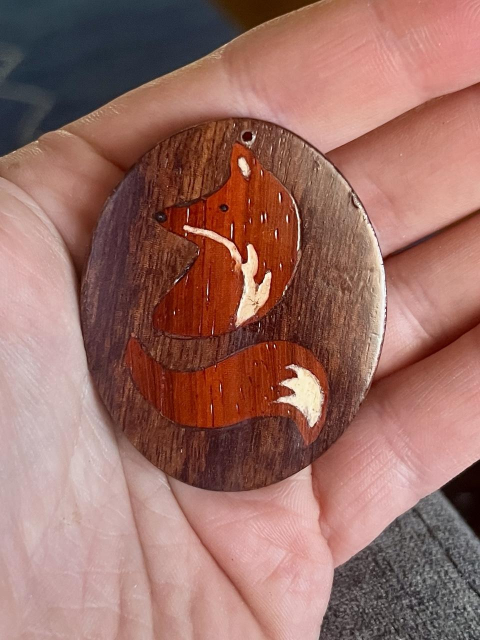 Woodworking; fox inlaid into oval medallion 