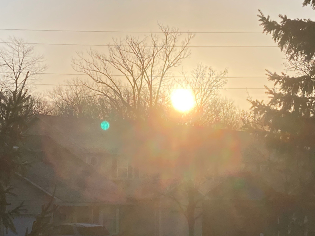A DRONE! 

Or just the sun. 
