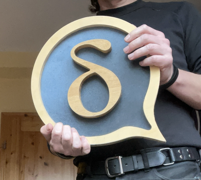 the deltachat logo in "real", made out of wood