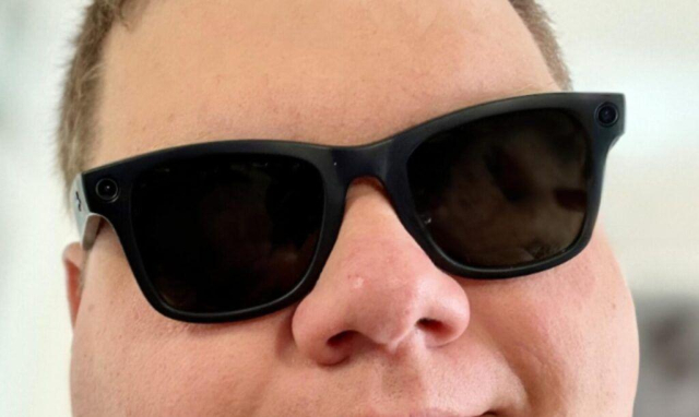 Meta Ray Ban Wayfarer sunglasses on a man's face. The camera is on the right edge of the frame with an indicator light on the right keeping the frames balanced.