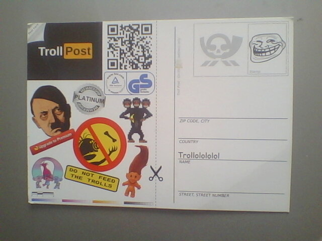 A postcard. On the left we see "TrollPost" and several images referencing trolls or internet trolls (at least I think that's what it is, I don't know them). On the right side we see a place for a stamp, which has the typical internet meme "trollface". There's also place to write an address. The address is empty except for the country which says "Trollolololol"